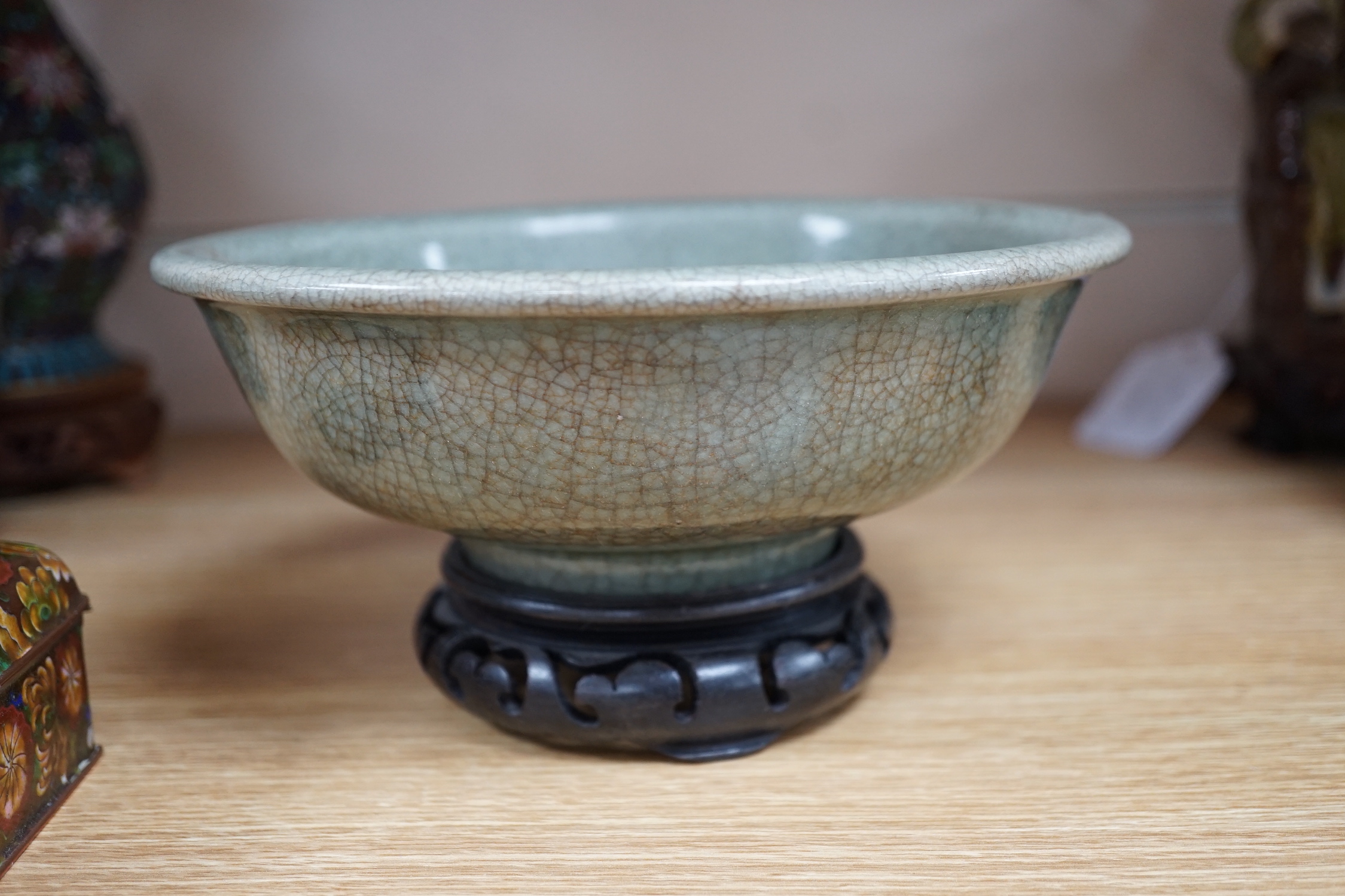 A Chinese Guan type green crackle glaze bowl, early 20th century 19cm diameter, on hardwood stand